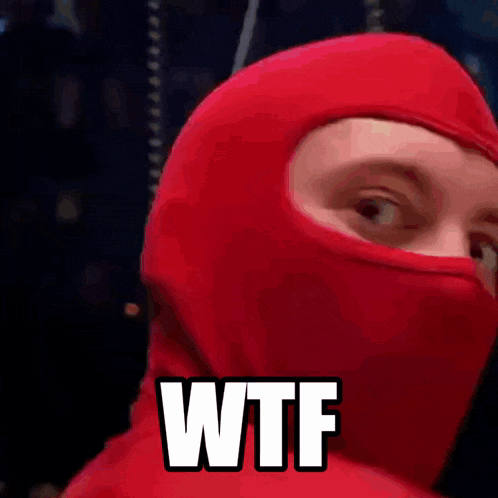 a person wearing a red ski mask with the word wtf on it