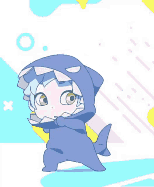 a little girl is wearing a shark costume