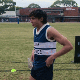 a man wearing a blue and white jersey that says cum ords on it