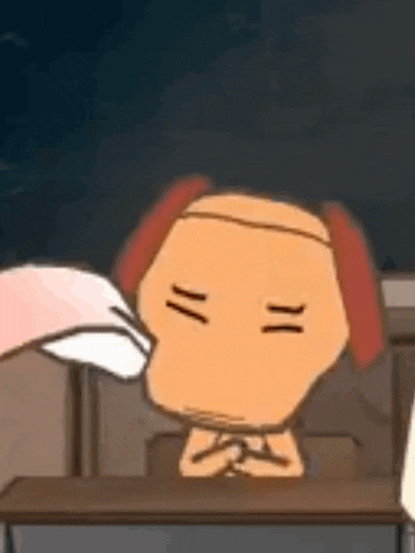 a cartoon character is sitting at a desk in a classroom with his eyes closed and his hands folded .