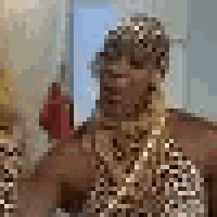a close up of a woman wearing a gold necklace .