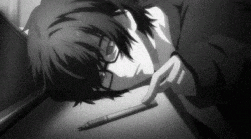 a black and white photo of a person laying on the floor with a pen