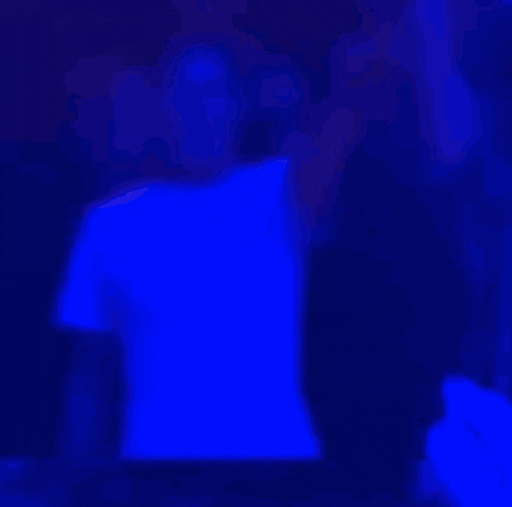 a blurry picture of a person with their arms up