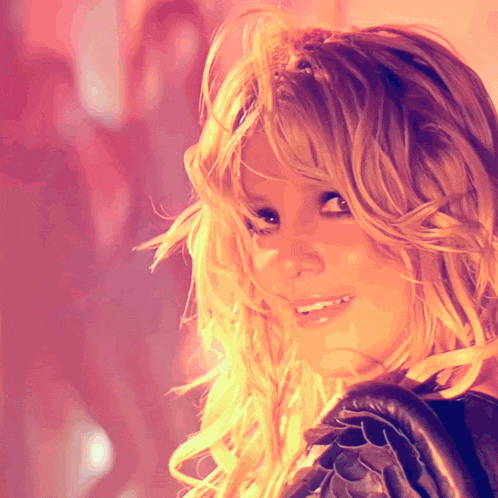 a close up of a woman with blonde hair