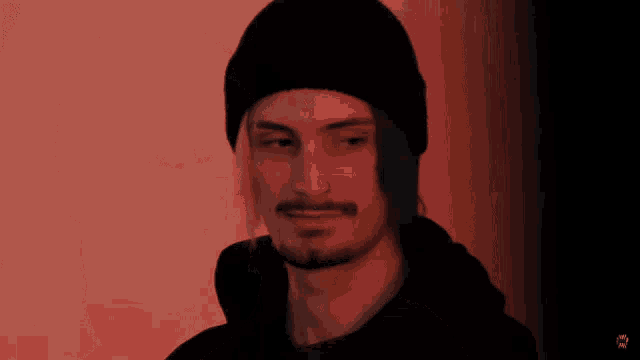a blurry picture of a man with a red background