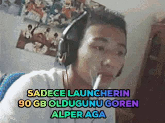 a man wearing headphones is smoking a cigarette and says sadece launcherin