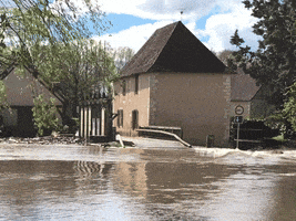 a flooded area with a sign that says no trucks