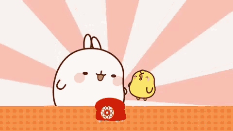 a cartoon rabbit is standing on top of a red telephone next to a yellow chicken .