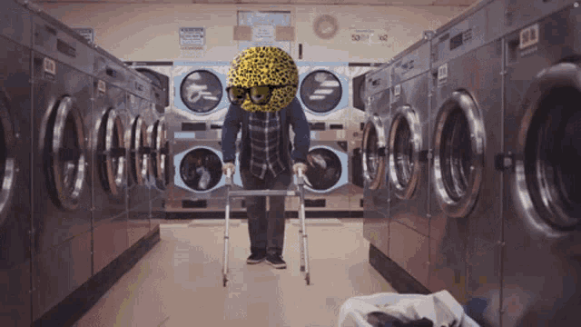 a laundromat with a sign that says ' caution ' on it