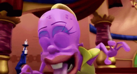 a purple cartoon character is laughing and holding a candle