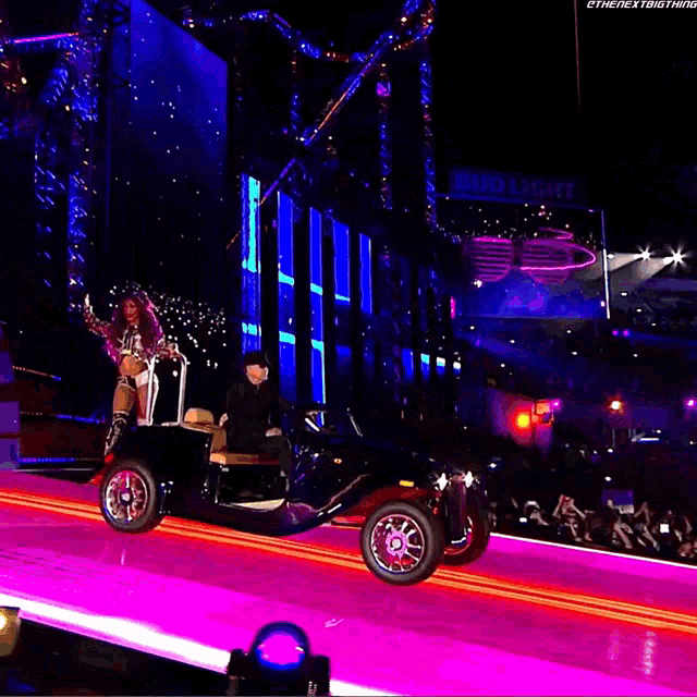 a stage with a bud light sign behind it