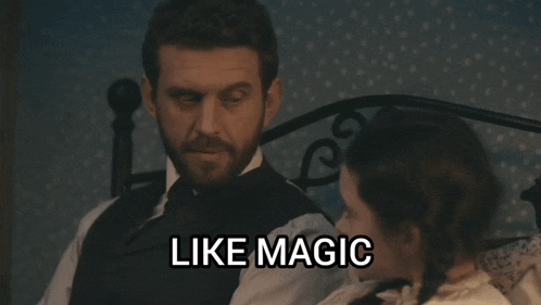a man with a beard sits next to a little girl with the words like magic written below him