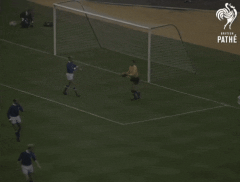 a soccer game is being played on a field that says pathe on the bottom