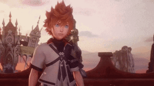 a young boy with orange hair and blue eyes is standing in front of a castle in a video game .