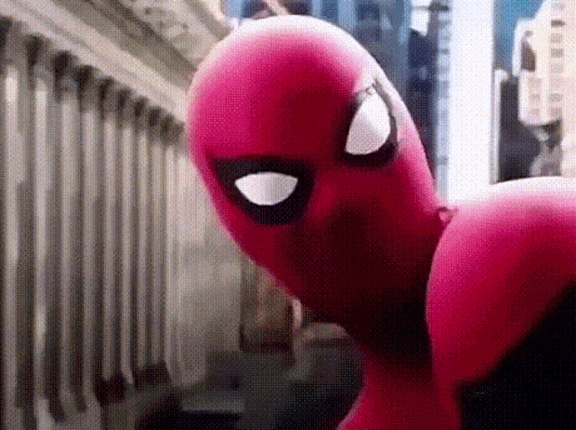 a close up of a spider-man costume on a city street .