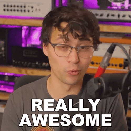 a man wearing glasses and a gray shirt says really awesome