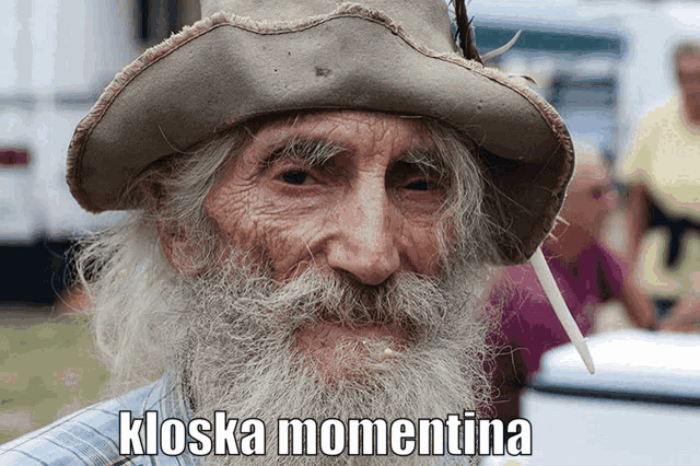 a man with a beard wearing a cowboy hat has the word kioska momentina written below him