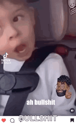 a baby is sitting in a car seat and making a face .