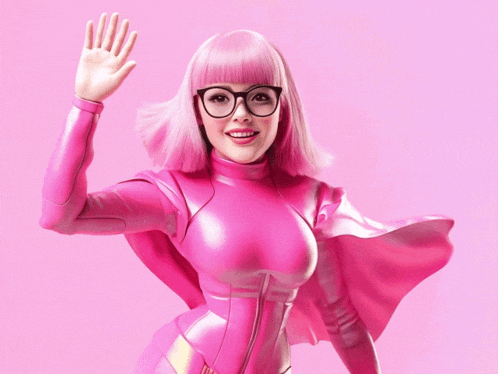 a woman with pink hair and glasses is wearing a pink suit