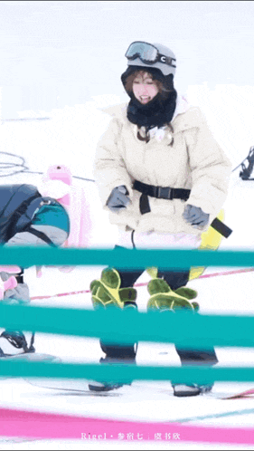 a person wearing a white jacket and goggles stands in the snow