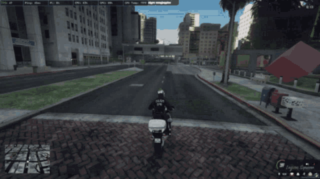 a police officer is riding a motorcycle down a city street