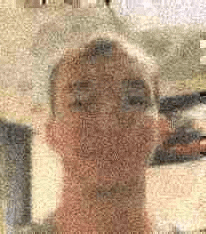 a close up of a person 's face made up of a lot of words .