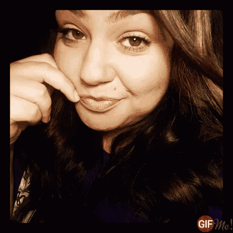 a close up of a woman 's face with a gif me watermark on the bottom right
