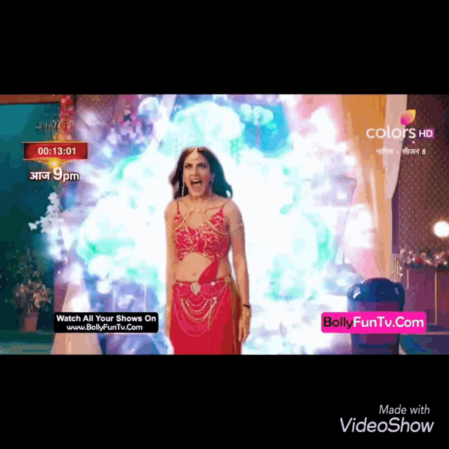 a woman in a red dress is standing in front of a screen that says bollyfuntv.com