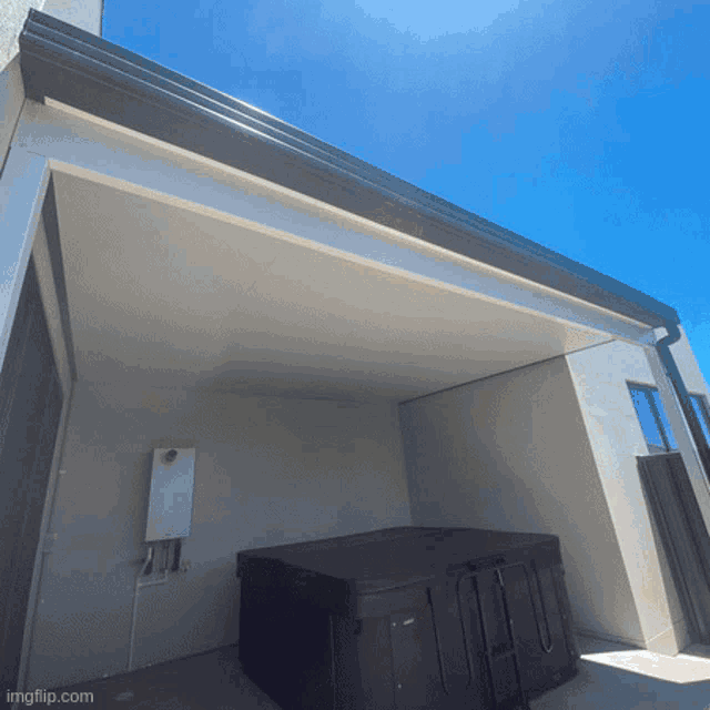 a picture of a hot tub under a roof with imgflip.com written on the bottom