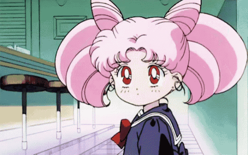 a little girl with pink hair and red eyes is standing in a hallway