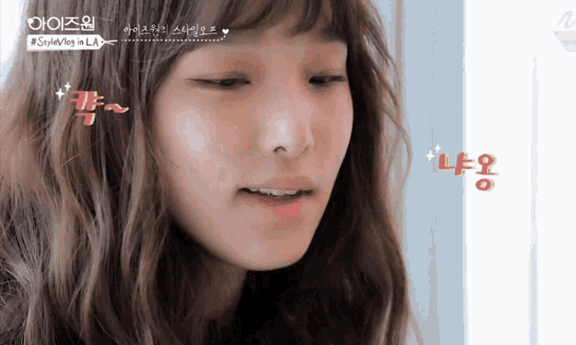 a close up of a woman 's face with #stylevlog in la written on the bottom right