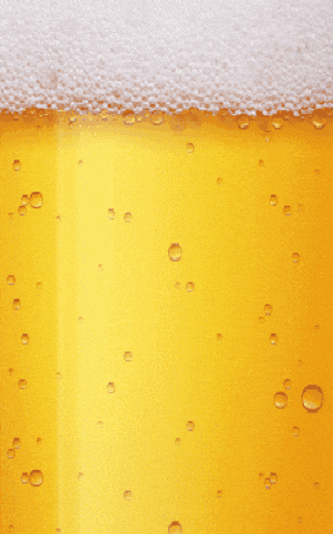 a close up of a beer with bubbles and foam