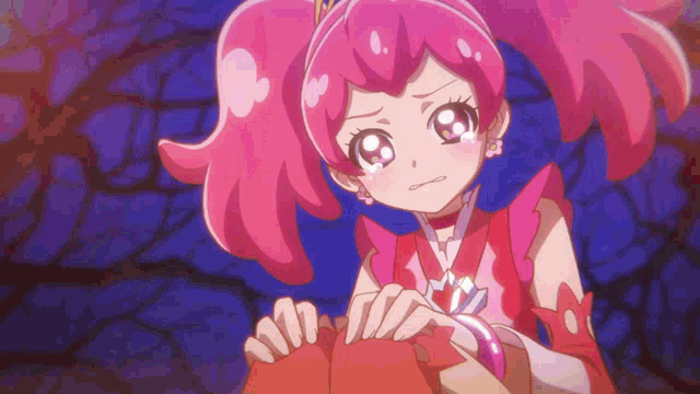 a cartoon girl with pink hair is holding a red object