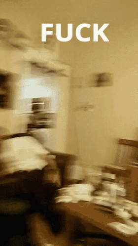 a blurry picture of a room with the word fuck in white