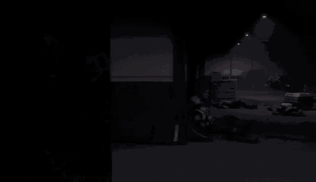 a robot in a dark room with the letter a on its head