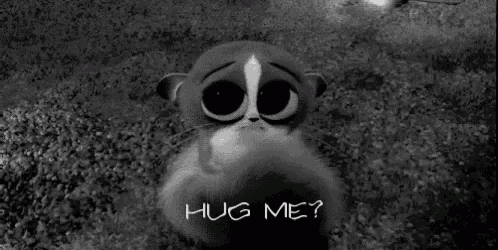a black and white photo of a cartoon cat asking to hug him .