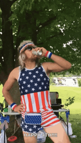 a man in an american flag outfit drinking a beer