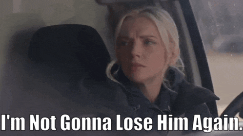 a woman sitting in a car with the words " i 'm not gonna lose him again "