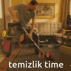 a man is using a vacuum cleaner in a living room with the words temizlik time written below him