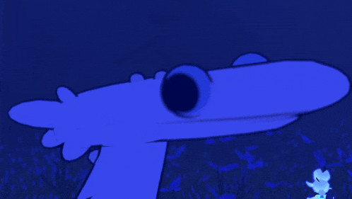 a blue cartoon character with a big eye is standing in the grass .