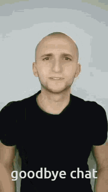 a bald man wearing a black shirt is saying goodbye chat