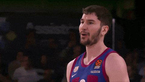 a man with a beard is wearing a jersey that says ' turkish airlines ' on the front