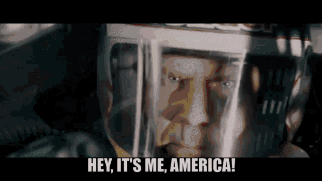 a man wearing a helmet with the words hey it 's me america on the bottom