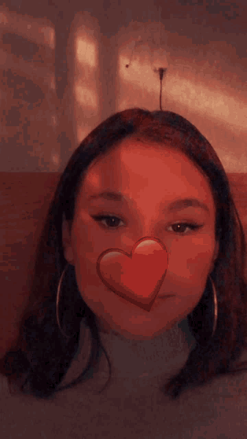 a girl with a heart on her nose