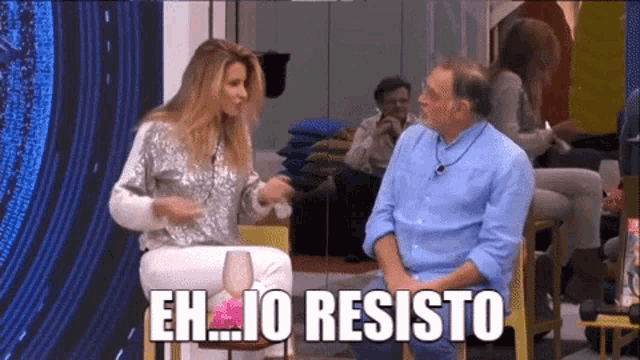 a woman sitting next to a man with the words eh io resisto written on the screen