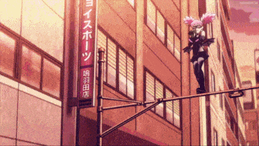 a girl is standing on a pole in front of a building with chinese writing