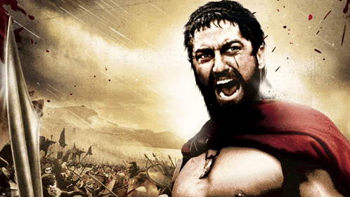 a man with a beard and a red cape is holding a sword