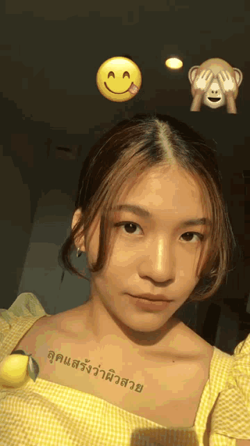 a girl with a tattoo on her chest that says ' a '