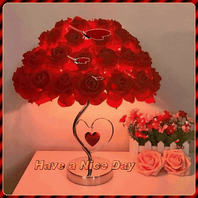 a picture of a lamp with red roses and the words have a nice day on it