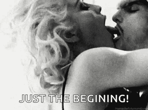 a man and a woman are kissing in a black and white photo with the words `` just the beginning '' .